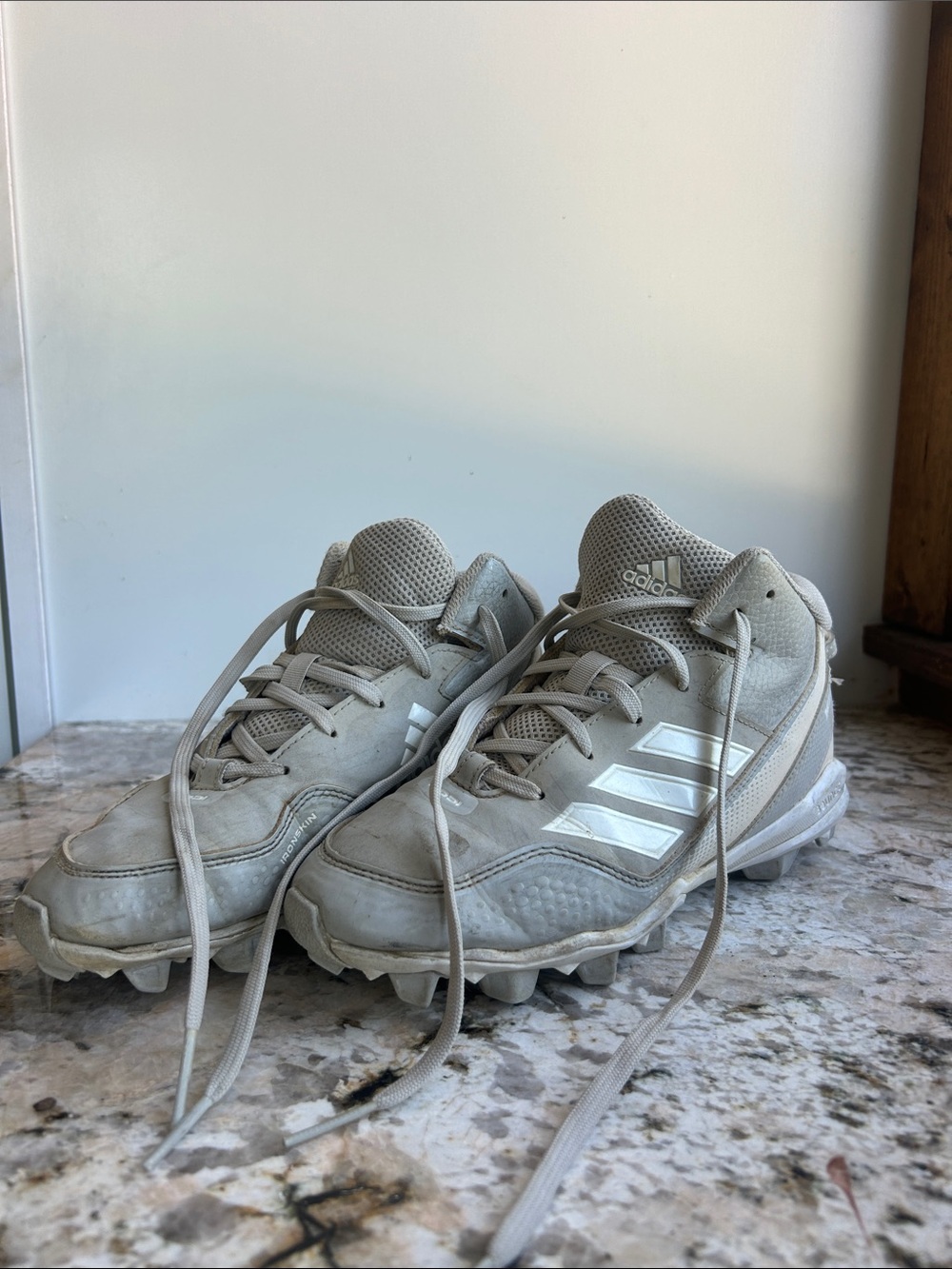 Adidas Kids size 5 Light Gray Baseball cleats with White Stripes